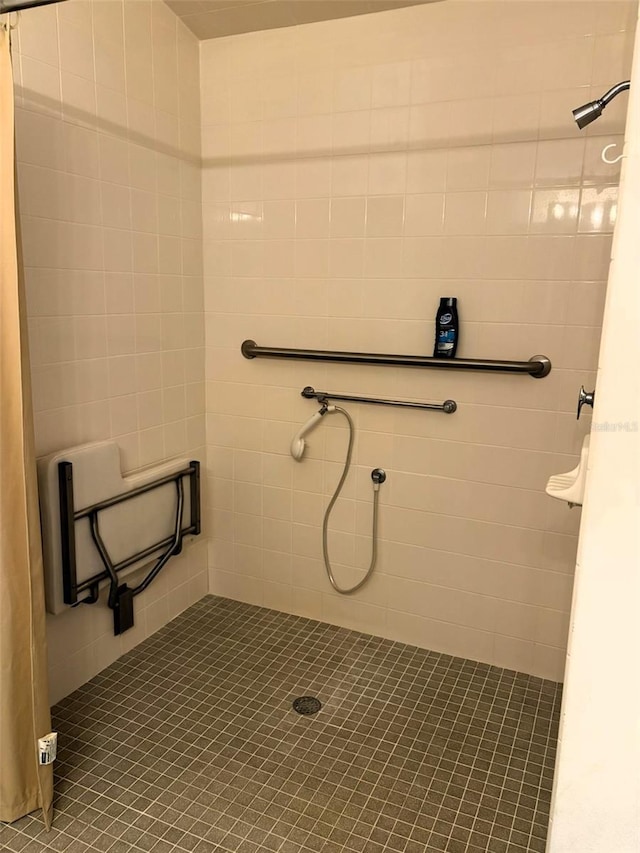 bathroom with a tile shower