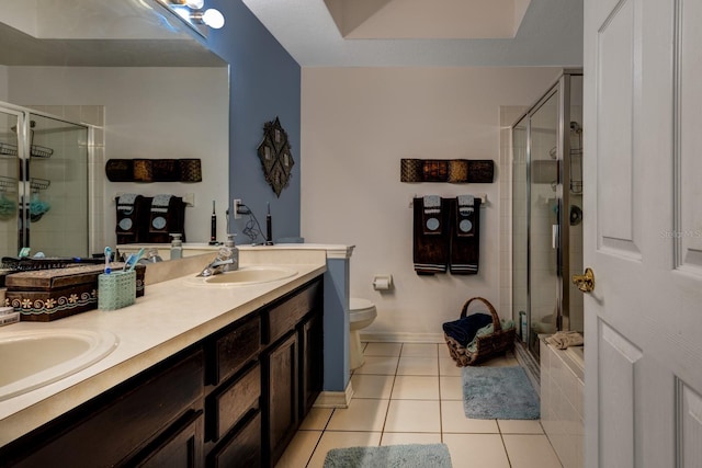 bathroom featuring an enclosed shower, vanity, toilet, and tile patterned floors