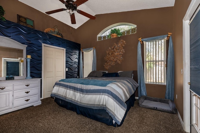 carpeted bedroom featuring vaulted ceiling and ceiling fan