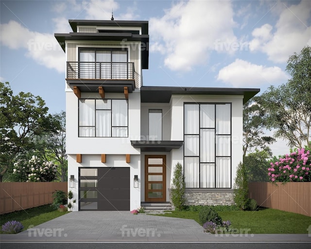 view of front of property with a garage and a balcony