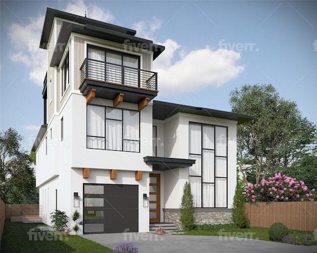 modern home featuring a garage and a balcony