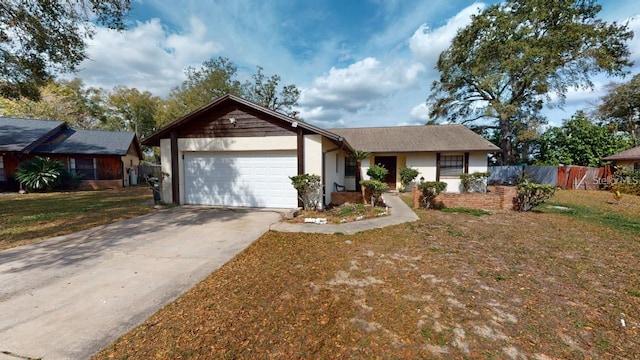 ranch-style home featuring a garage and a front yard