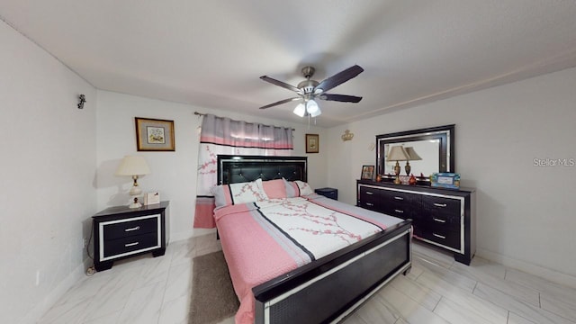 bedroom featuring baseboards and a ceiling fan