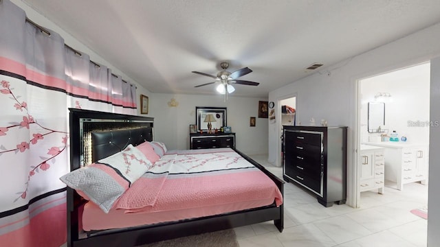 bedroom featuring ceiling fan, visible vents, and connected bathroom