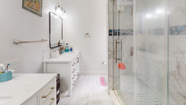 full bathroom featuring baseboards, vanity, and a marble finish shower