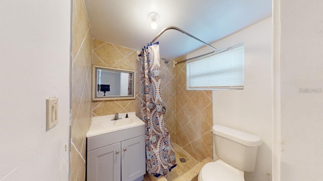 bathroom with walk in shower, vanity, and toilet