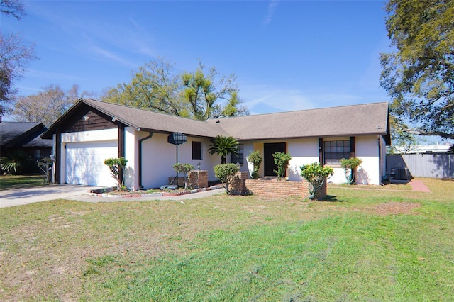 ranch-style home with an attached garage, a front lawn, concrete driveway, and stucco siding