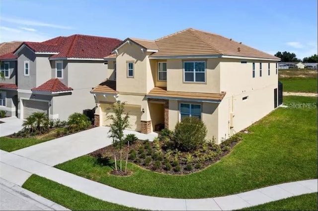 view of front of house featuring a garage and a front yard