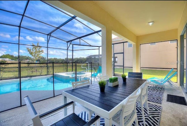 view of swimming pool featuring an in ground hot tub, a lanai, and a patio area