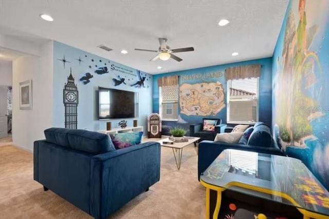 carpeted living room featuring ceiling fan