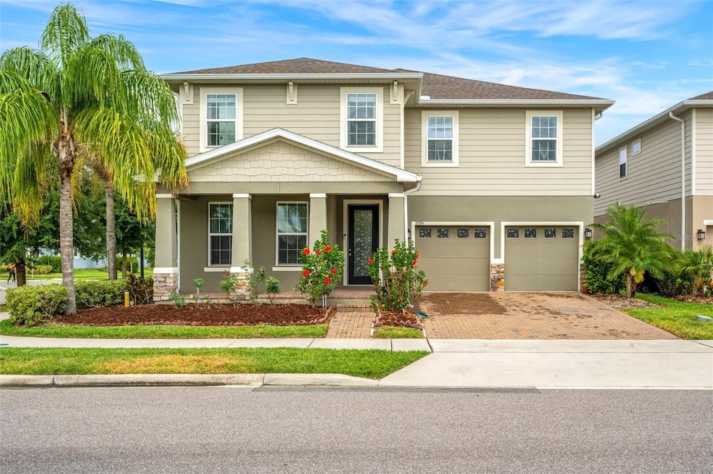 view of front of home featuring a garage and covered porch