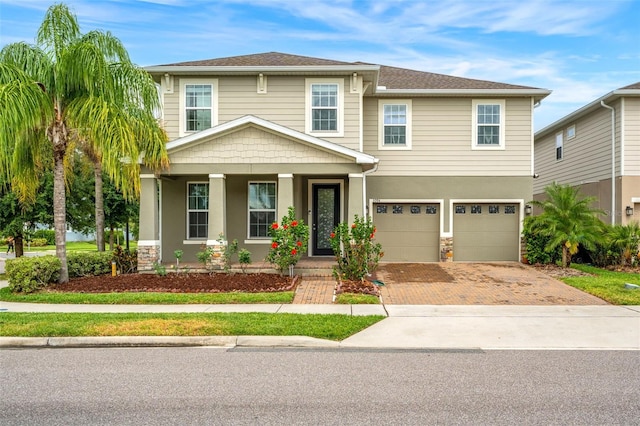 view of front of home featuring a garage and covered porch