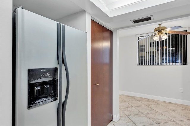 kitchen featuring stainless steel fridge, ceiling fan, and light tile patterned flooring