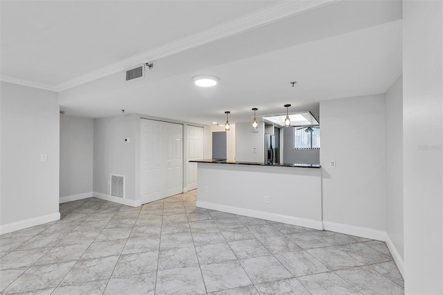 unfurnished living room featuring crown molding