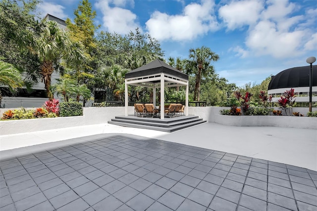 view of patio featuring an outdoor living space and a gazebo