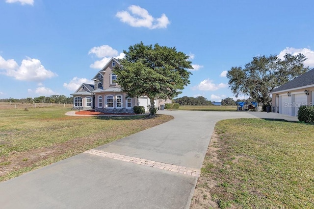 exterior space featuring a garage and a front lawn