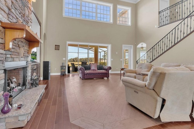 living room with hardwood / wood-style flooring and a fireplace