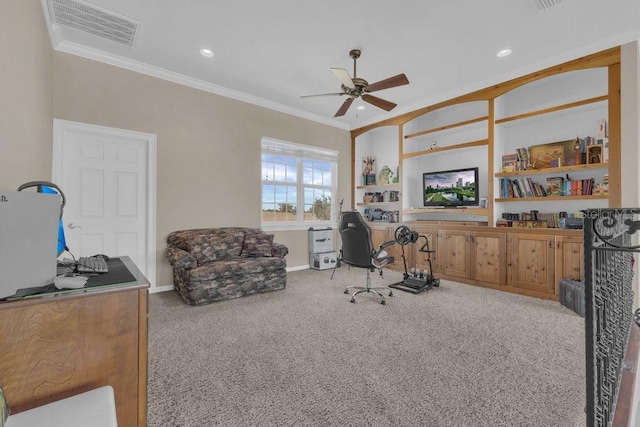 office space featuring crown molding, light colored carpet, and ceiling fan