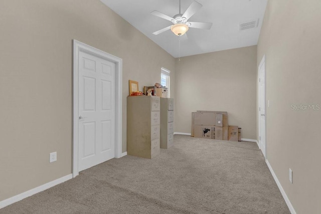 interior space featuring ceiling fan and light carpet