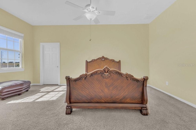 bedroom with ceiling fan and light carpet