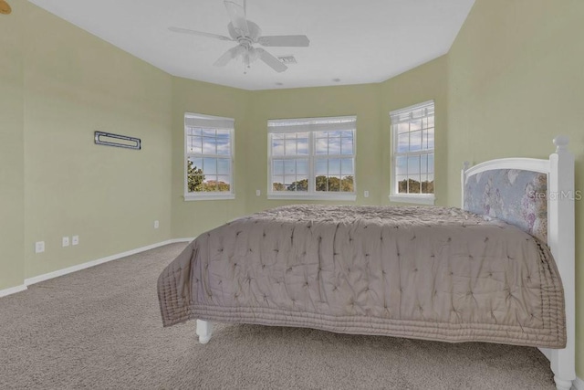 unfurnished bedroom featuring ceiling fan and carpet