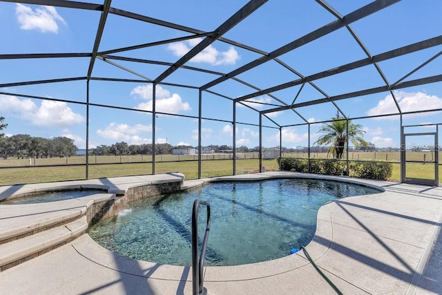 view of swimming pool featuring a lanai, a patio area, and an in ground hot tub