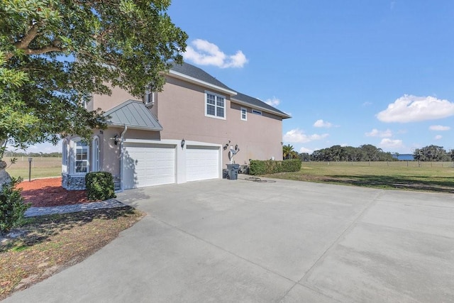 view of side of property with a garage