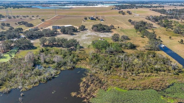 birds eye view of property with a water view and a rural view