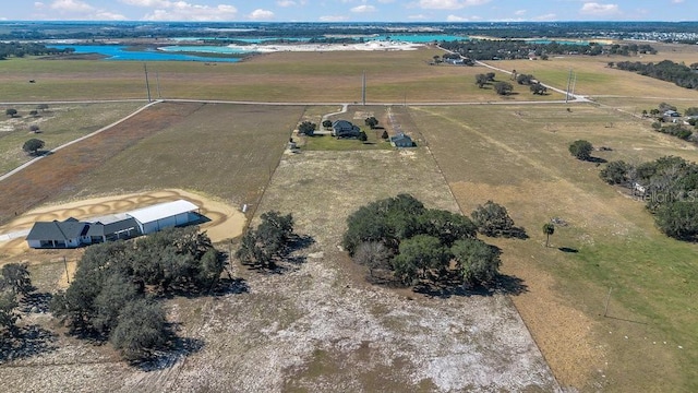 drone / aerial view featuring a water view and a rural view