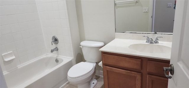 full bathroom with vanity, tiled shower / bath, and toilet