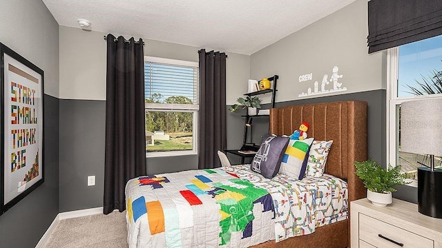 bedroom with carpet flooring and a textured ceiling