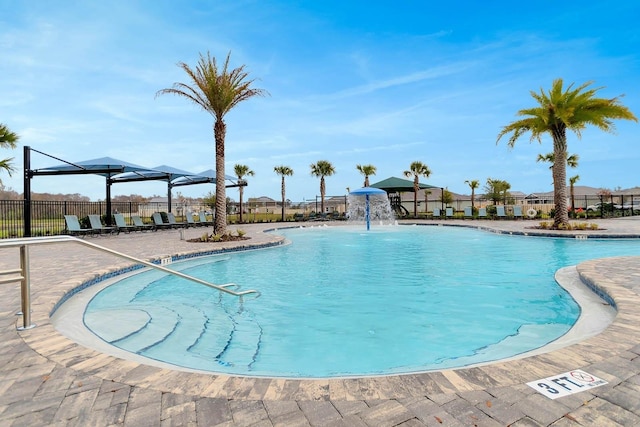 view of swimming pool featuring pool water feature