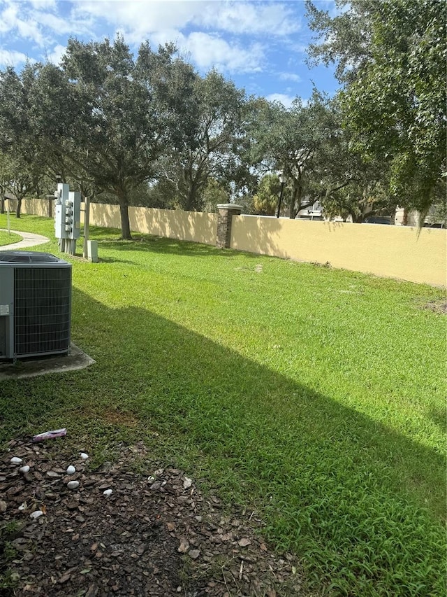 view of yard with central AC unit