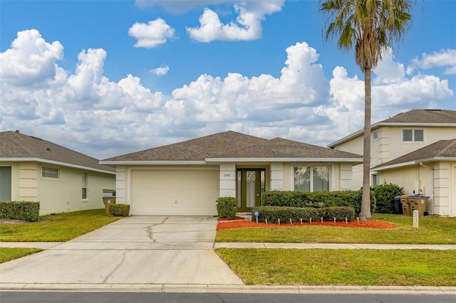 view of front facade featuring a garage and a front yard