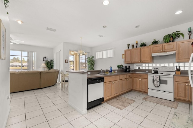 kitchen with pendant lighting, sink, light tile patterned floors, kitchen peninsula, and white appliances