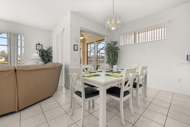 dining room featuring light tile patterned floors and a notable chandelier