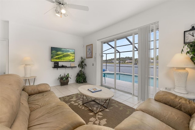 living room with ceiling fan and light tile patterned floors