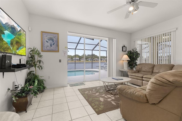 living room featuring light tile patterned flooring and ceiling fan