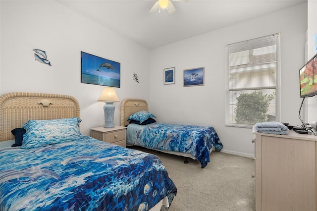 bedroom with ceiling fan and light colored carpet