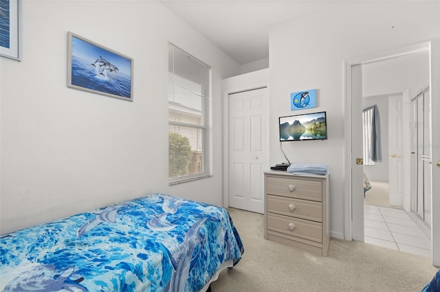 carpeted bedroom featuring a closet