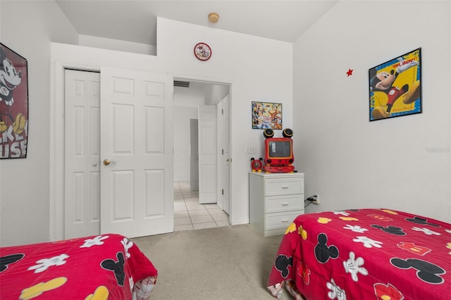 carpeted bedroom with a closet