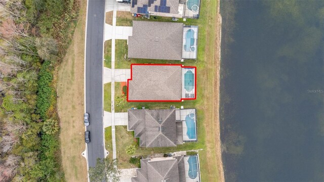 birds eye view of property featuring a water view