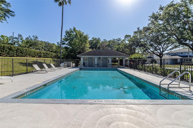 view of swimming pool featuring a patio area