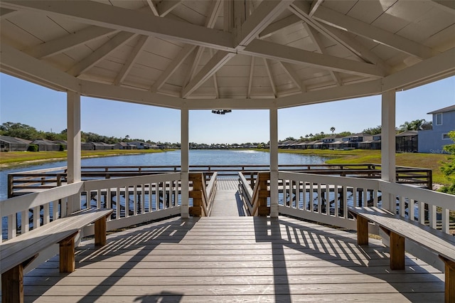 view of dock featuring a gazebo and a water view