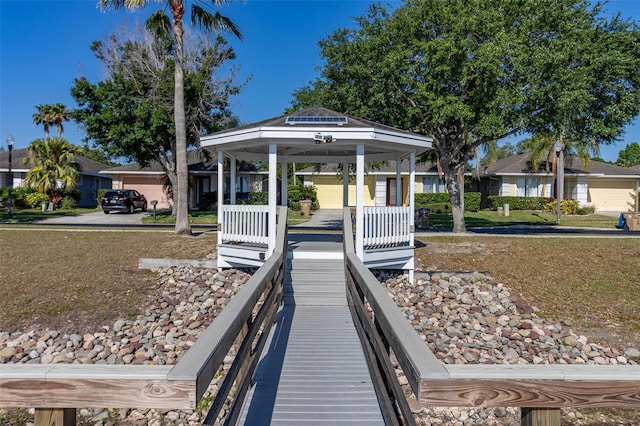 dock area featuring a gazebo and a lawn