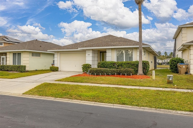 view of front of property with a garage and a front yard