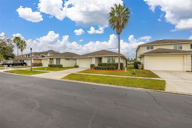 view of front of home with a garage and a front lawn