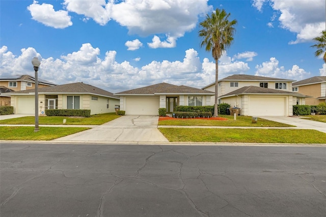 view of front of home with a garage and a front lawn