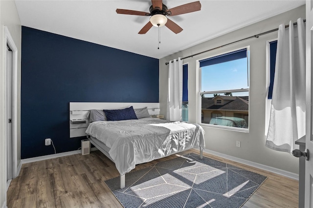 bedroom featuring ceiling fan and hardwood / wood-style floors