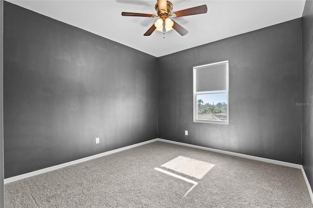 unfurnished room featuring carpet and ceiling fan